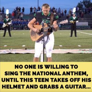 High schooler takes off his helmet and grabs a guitar to sing national anthem