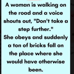 A woman is walking on the road and a..